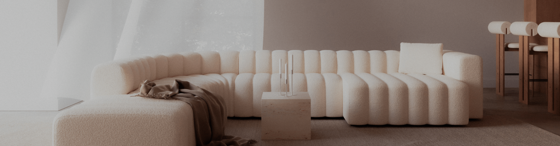 Un sofá blanco en una habitación bien iluminada con muebles de diseño alrededor.